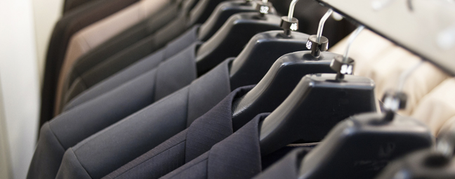 Row of suits on hangers
